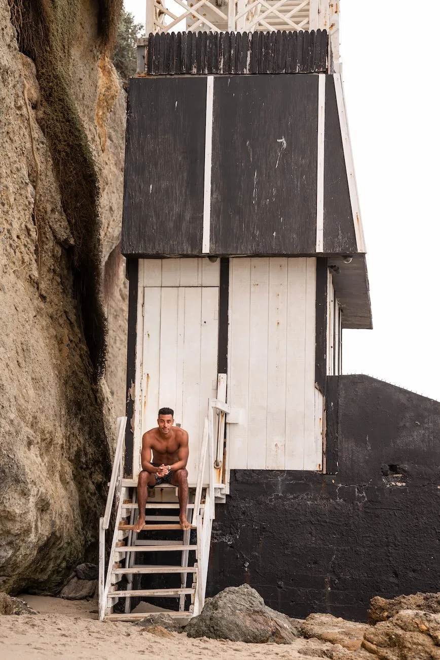 White house on a rocky cliff with an outside stair