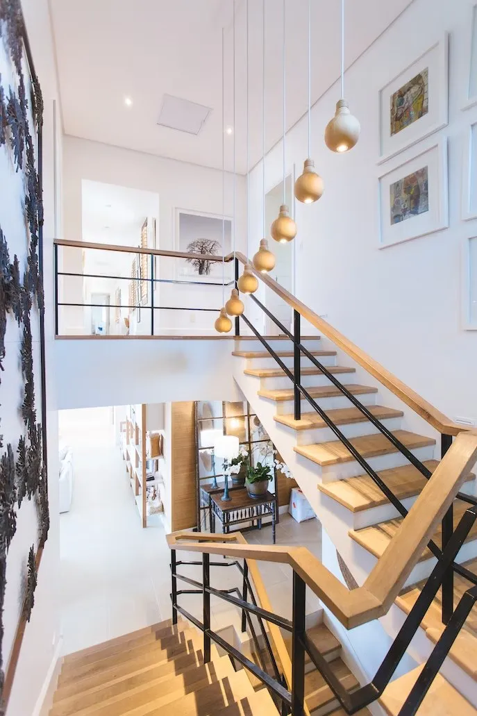 Oak stair in a white double-height hall