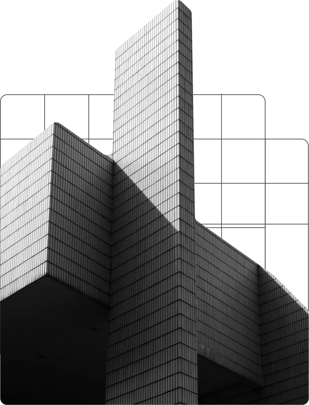 Black-and-white tiled tower rising in front of a faint architectural grid
